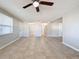 Spacious living room with tile floors and a ceiling fan at 1116 E Boyer St, Tarpon Springs, FL 34689