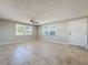 Spacious living room featuring tile floors and ceiling fan at 1116 E Boyer St, Tarpon Springs, FL 34689