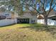 Backyard with covered patio and privacy fence at 11616 Crest Creek Dr, Riverview, FL 33569