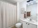Simple bathroom with a shower/tub combo and striped curtain at 11616 Crest Creek Dr, Riverview, FL 33569