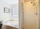 Clean bathroom with a bathtub and a separate shower at 11616 Crest Creek Dr, Riverview, FL 33569