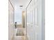 Clean bathroom with a bathtub, shower and double closets at 11616 Crest Creek Dr, Riverview, FL 33569