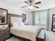 Main bedroom with king-size bed, and large windows at 11616 Crest Creek Dr, Riverview, FL 33569
