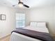 Bright bedroom with a double bed and large window at 11616 Crest Creek Dr, Riverview, FL 33569