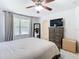 Spacious bedroom with king-size bed, dresser, and TV at 11616 Crest Creek Dr, Riverview, FL 33569