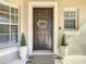 Attractive dark brown front door decorated with a natural wreath at 11616 Crest Creek Dr, Riverview, FL 33569
