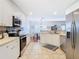 Modern kitchen with stainless steel appliances and white cabinets at 11616 Crest Creek Dr, Riverview, FL 33569