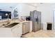 Modern kitchen with stainless steel appliances and white cabinets at 11616 Crest Creek Dr, Riverview, FL 33569