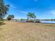 Peaceful lakefront view with walking path and lush greenery at 11616 Crest Creek Dr, Riverview, FL 33569