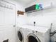 Laundry room with washer, dryer, and shelving at 11616 Crest Creek Dr, Riverview, FL 33569