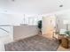 Open living area with a large chandelier and access to another room at 11616 Crest Creek Dr, Riverview, FL 33569
