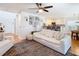 Living room features white sofa, kitchen view, and a gallery wall at 11616 Crest Creek Dr, Riverview, FL 33569