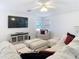 Spacious living room featuring sectional sofa, large TV, and cozy seating at 11616 Crest Creek Dr, Riverview, FL 33569