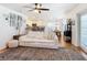 Open concept living room with white sofa, kitchen view, and hardwood floors at 11616 Crest Creek Dr, Riverview, FL 33569