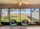 Peaceful screened patio with lake view and lush landscaping at 11616 Crest Creek Dr, Riverview, FL 33569