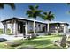 Relaxing outdoor space with lounge chairs and cornhole at 11830 Starbright Path, Venice, FL 34293