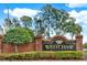 Westchase community entrance sign with brick pillars and landscaping at 12118 Glencliff Cir, Tampa, FL 33626