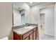 Clean bathroom with vanity and access to laundry at 13456 Marble Sands Ct, Hudson, FL 34669