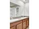 Double vanity bathroom with granite countertops at 13456 Marble Sands Ct, Hudson, FL 34669
