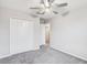 Bedroom with ceiling fan and double door closet at 13456 Marble Sands Ct, Hudson, FL 34669