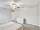 Spacious bedroom with ceiling fan and neutral decor at 13456 Marble Sands Ct, Hudson, FL 34669