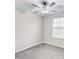 Bright bedroom with ceiling fan and window at 13456 Marble Sands Ct, Hudson, FL 34669