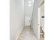 Bright entry hall with tile floor and half bath at 13456 Marble Sands Ct, Hudson, FL 34669