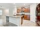 Modern kitchen with granite island and stainless steel appliances at 13456 Marble Sands Ct, Hudson, FL 34669