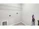 Laundry room with shelving and hookups at 13456 Marble Sands Ct, Hudson, FL 34669