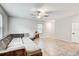 Spacious living area with L-shaped couch and tile floors at 13456 Marble Sands Ct, Hudson, FL 34669
