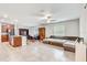 Open living space with L-shaped sectional sofa and kitchen island at 13456 Marble Sands Ct, Hudson, FL 34669