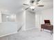 Spacious loft area with ceiling fan and neutral decor at 13456 Marble Sands Ct, Hudson, FL 34669