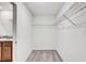 Spacious walk-in closet with wire shelving at 13456 Marble Sands Ct, Hudson, FL 34669