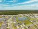 Aerial view of a beautiful community with a lake at 13580 Willow Bluestar Loop, Riverview, FL 33579