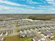 Aerial view of a large residential area with lake at 13580 Willow Bluestar Loop, Riverview, FL 33579