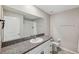 Clean bathroom, granite countertop, white cabinets, and a shower/tub combo at 13580 Willow Bluestar Loop, Riverview, FL 33579