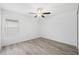 Spacious bedroom featuring wood-look floors and a ceiling fan at 13580 Willow Bluestar Loop, Riverview, FL 33579