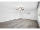 Bright bedroom with ceiling fan and grey vinyl plank flooring at 13580 Willow Bluestar Loop, Riverview, FL 33579
