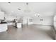 Open concept kitchen with island and stainless steel appliances at 13580 Willow Bluestar Loop, Riverview, FL 33579