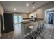 Modern kitchen featuring granite countertops and stainless steel appliances at 1412 Columbia Ave, Palm Harbor, FL 34683