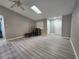 Bright living room featuring vinyl flooring and neutral walls at 1412 Columbia Ave, Palm Harbor, FL 34683