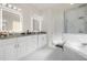 Bathroom with double vanity, soaking tub, and large shower at 15214 Octavia Ln, Odessa, FL 33556