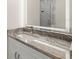 Bathroom with granite countertop and lit mirror at 15214 Octavia Ln, Odessa, FL 33556