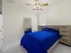 Bedroom with a blue comforter and built-in drawers at 15214 Octavia Ln, Odessa, FL 33556