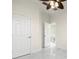 Bright bedroom with two doors and marble floors at 15214 Octavia Ln, Odessa, FL 33556