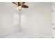Simple bedroom with ceiling fan and marble tile flooring at 15214 Octavia Ln, Odessa, FL 33556