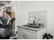 Convenient garage sink with granite countertop and cabinetry at 15214 Octavia Ln, Odessa, FL 33556