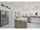 Modern kitchen with granite countertops and white cabinetry at 15214 Octavia Ln, Odessa, FL 33556