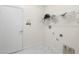 Laundry room with shelving and white tile floors at 15214 Octavia Ln, Odessa, FL 33556