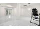 Spacious living room featuring marble flooring and modern chandelier at 15214 Octavia Ln, Odessa, FL 33556
